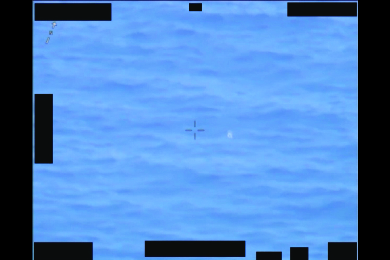 Declassified sensor image of a UAP over water off the U.S. East Coast in December 2019, marked with a crosshair