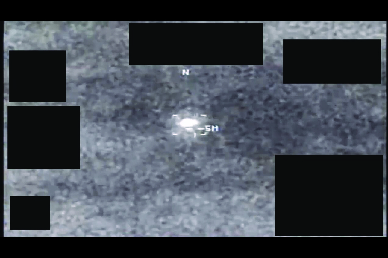 Declassified infrared sensor frame showing a high-contrast object near the center of the field of view