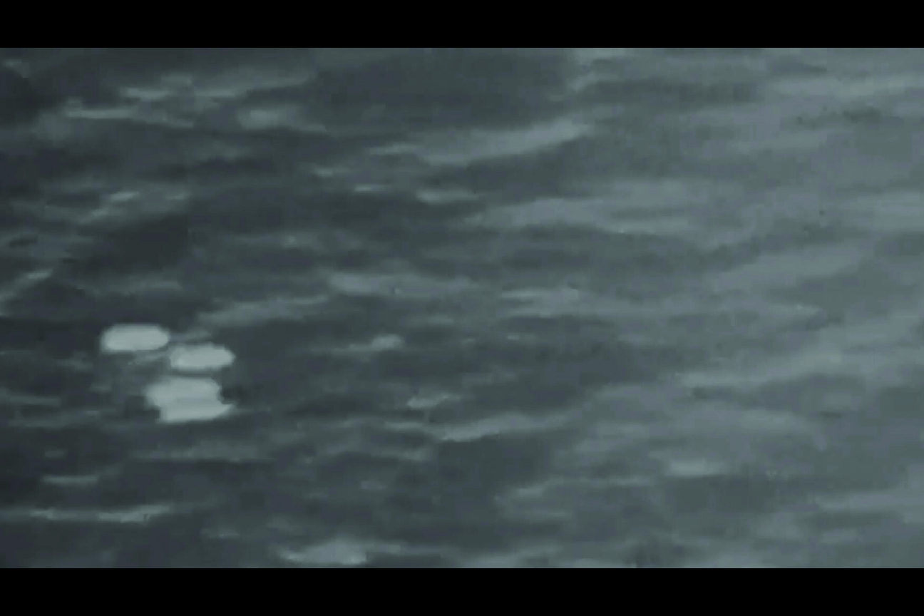Declassified infrared sensor frame showing several areas of contrast near the lower-left of the frame
