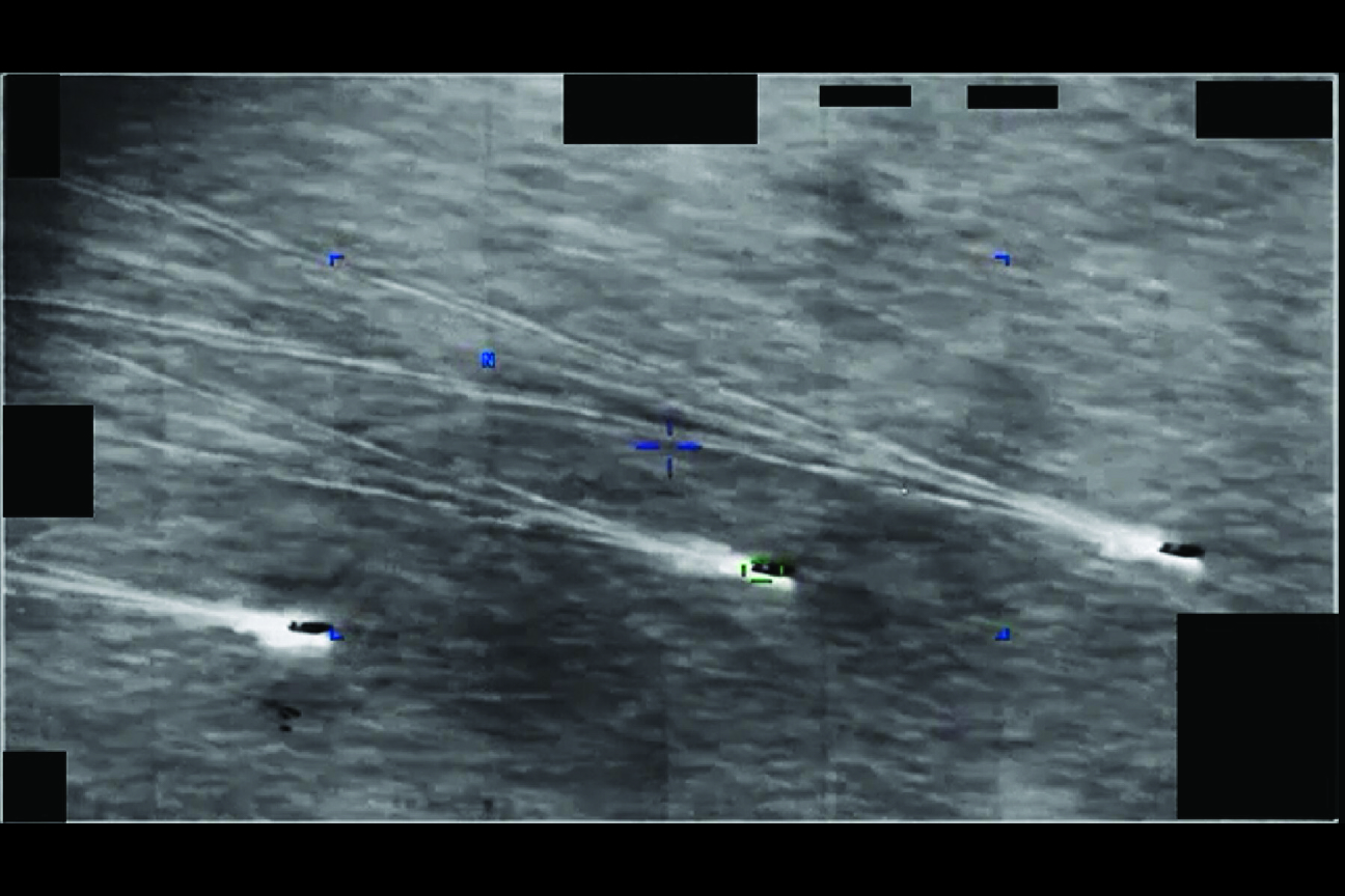 Declassified sensor image of four UAP in formation with trails and a targeting crosshair, recorded over Iran on 26 August 2022